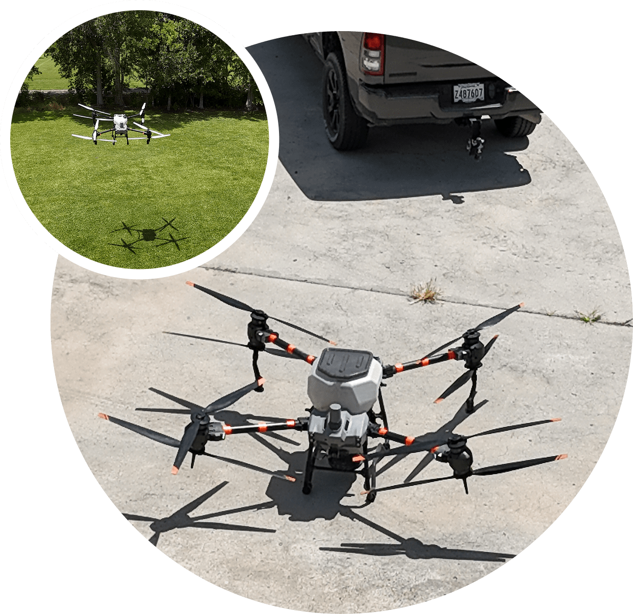4 A large drone is set up on pavement with a dog resting on grass in the background.